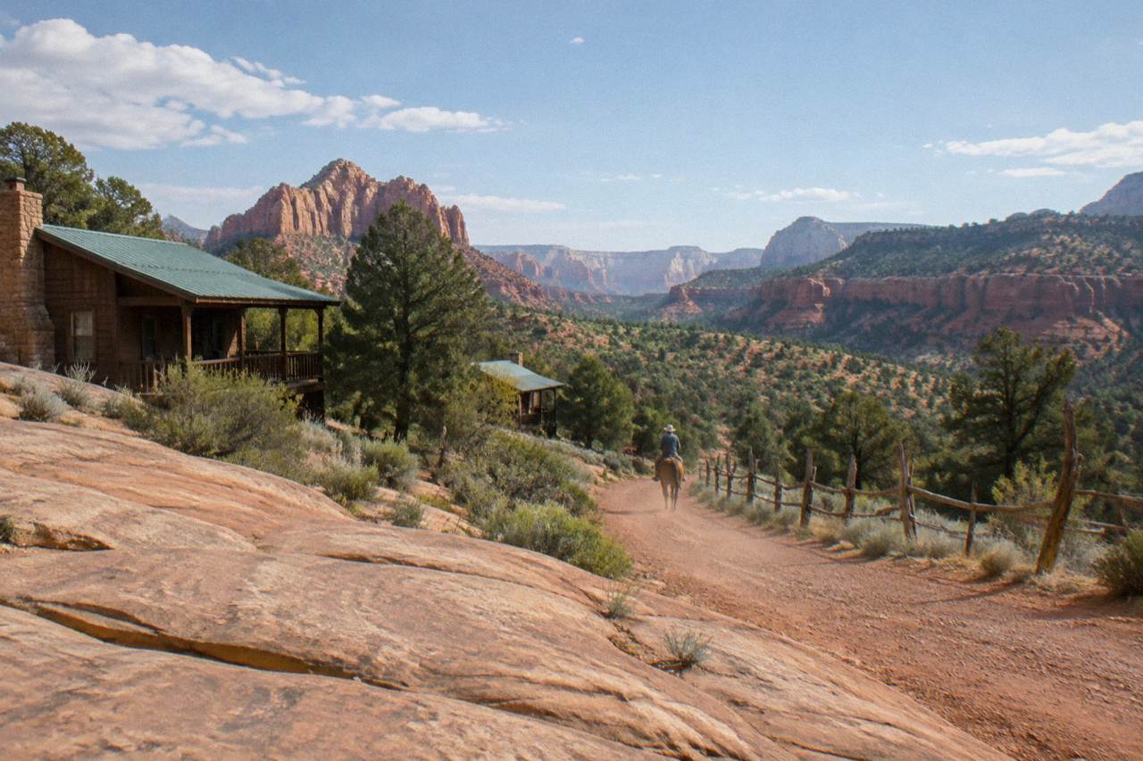 Red rock mesas and forested canyon rims under a wide desert sky in southern Utah