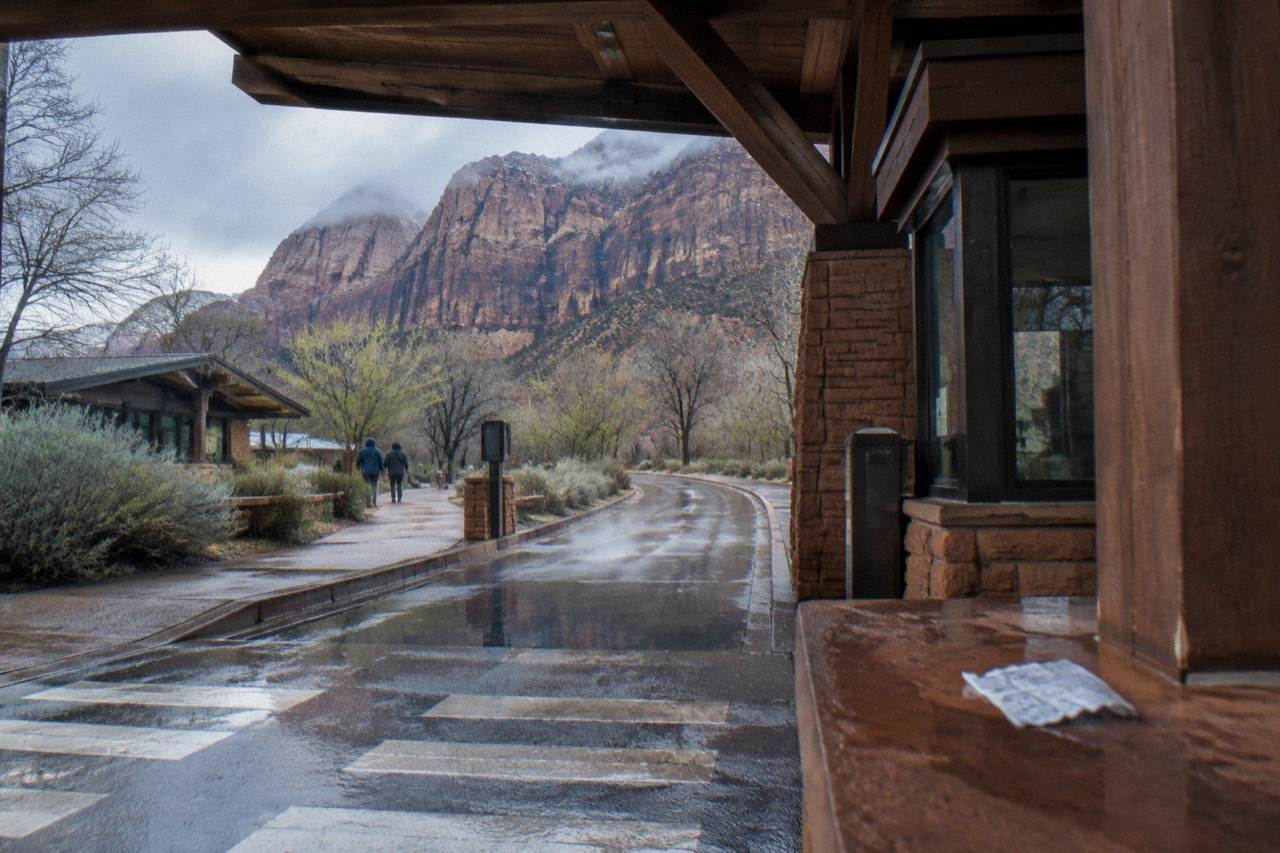 Entrance station booth at the edge of red rock cliffs in Zion National Park